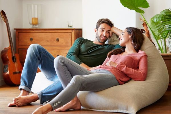 a couple relaxing and talking at home