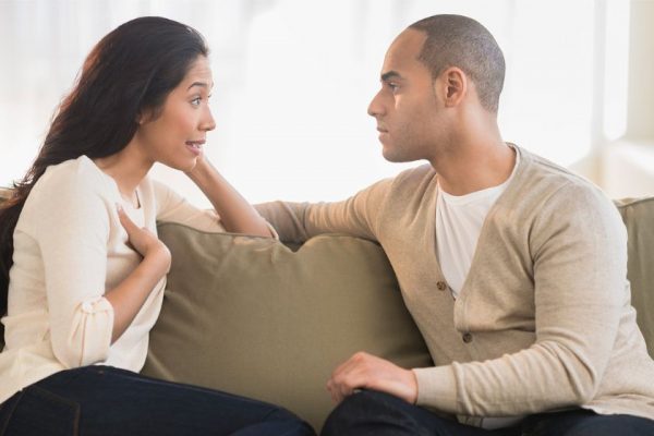 man and woman having a serious discussion