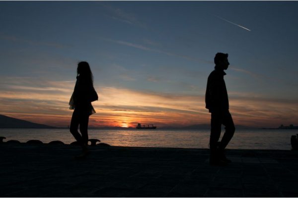 a man and a woman in a sad relationship separating - silhouette