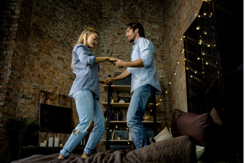 a couple dancing at home