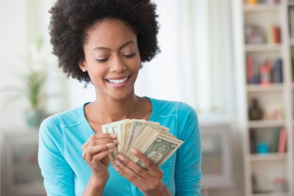 a black american woman with money