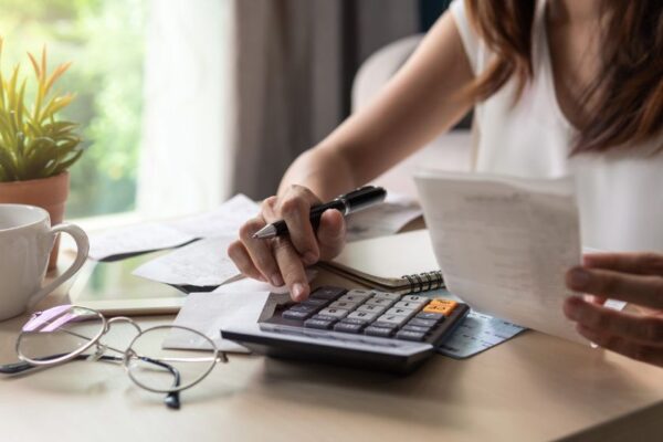 a woman calculating her finances