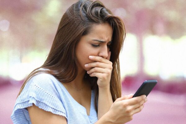 A woman chatting on her phone worried