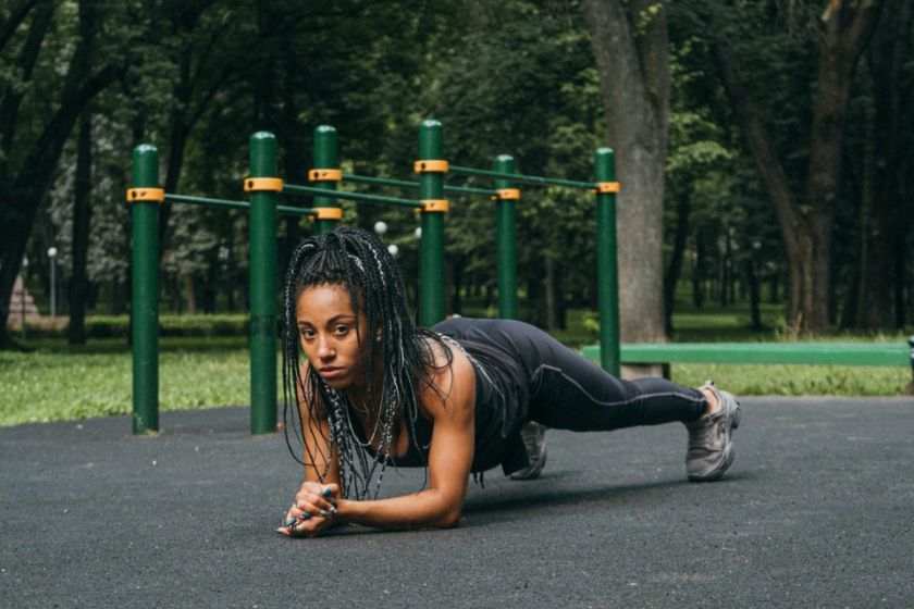 A black woman exercising to keep fit - habits of rich women