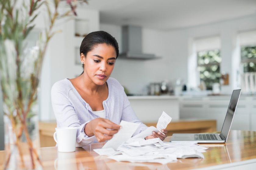 A black woman organizing her bills and finances