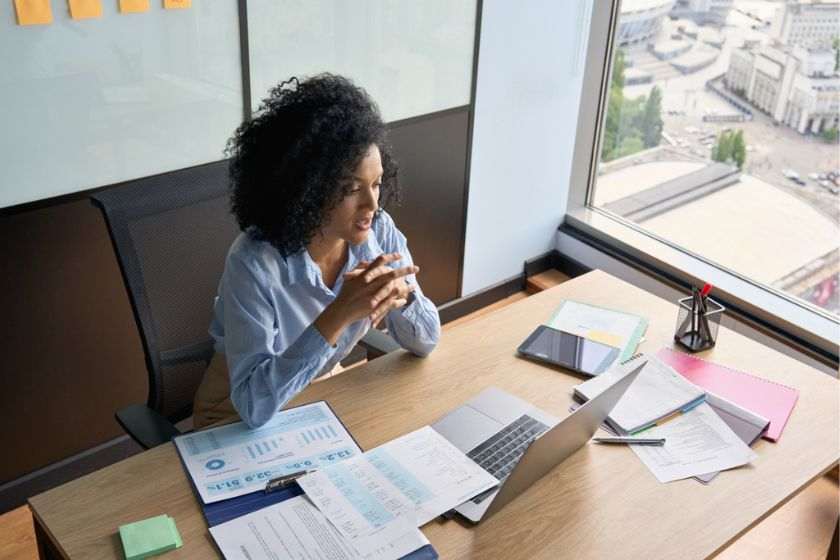 A black woman working in her office